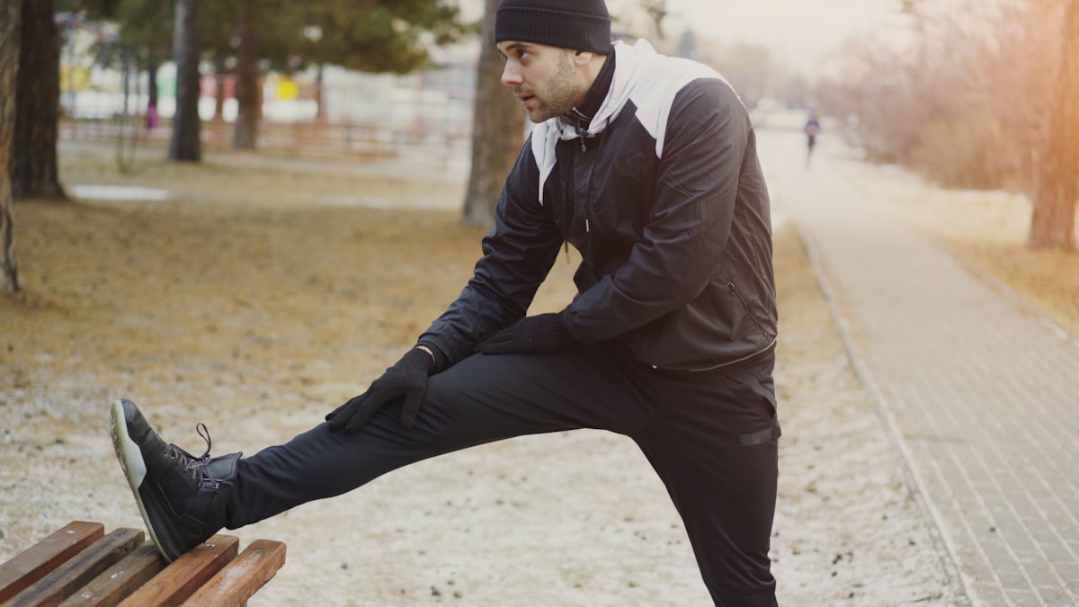 Senior man performing flexibility exercises